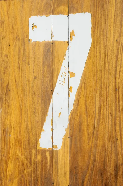 Yellow pine with a number seven — Stock Photo, Image