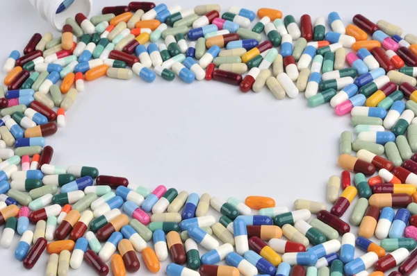 Multi colored pills and tablets — Stock Photo, Image
