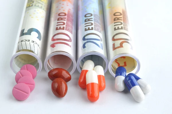 Medical pills in euro banknotes — Stock Photo, Image