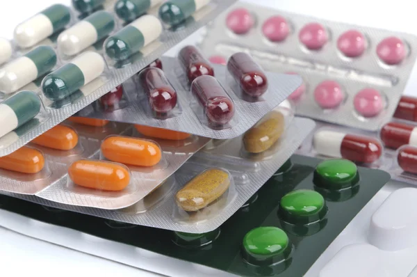 Pills and capsules in blister — Stock Photo, Image