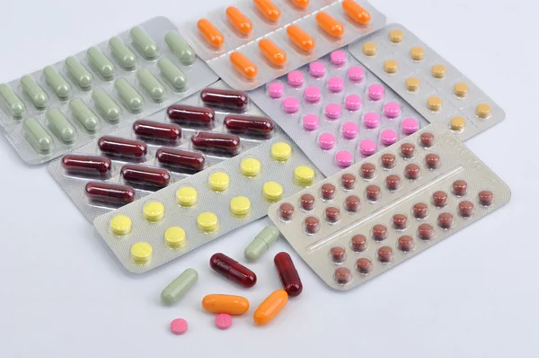 Pills and capsules in blister — Stock Photo, Image