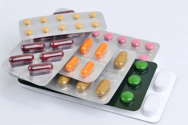 Pills and capsules in blister — Stock Photo, Image