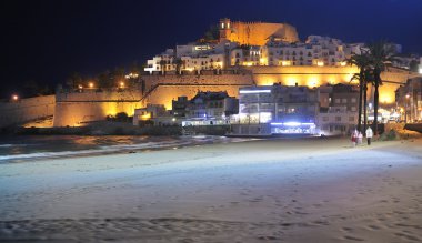 Night view of Mediterranean town clipart