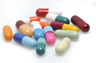 Assortment of pills and capsules clipart