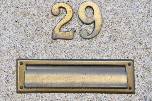 Bronze number twenty nine 29 with mailbox — Stock Photo, Image