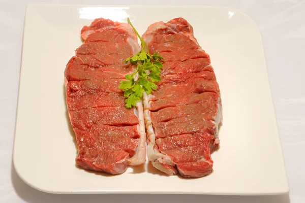 Beef steak raw entrecot with parsley — Stock Photo, Image