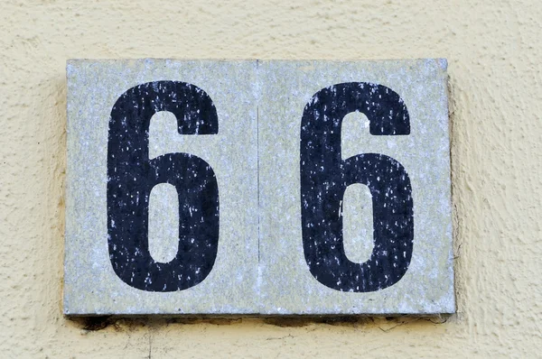 Granite with a number 66 — Stock Photo, Image