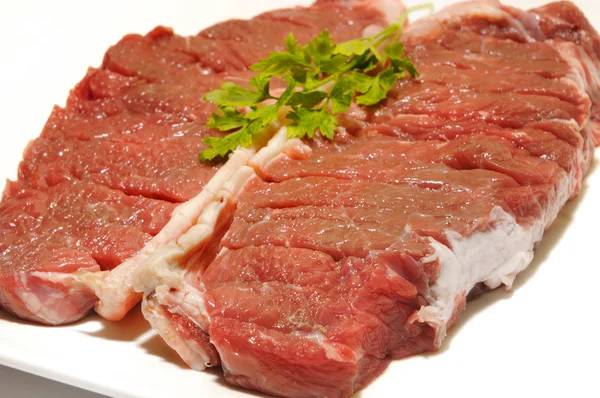 Beef steak raw entrecot with parsley — Stock Photo, Image