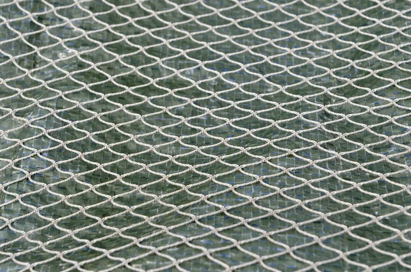 Knotted nylon net fishing and patter — Stock Photo, Image