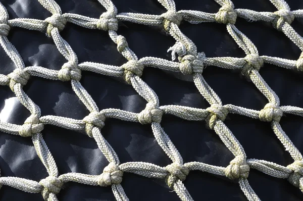 Knotted nylon net fishing and patter — Stock Photo, Image