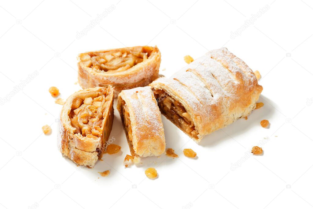 Traditional homemade apple strudel with caramelized apples and raisins. isolated on white background.