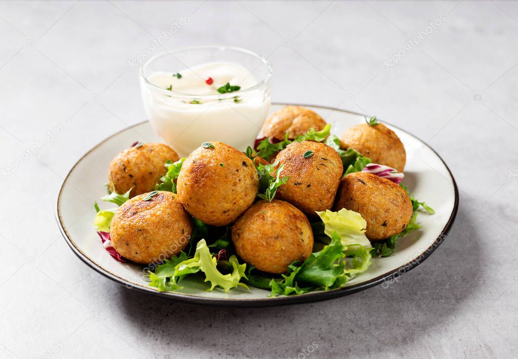 Vegetarian chickpeas falafel balls with fresh green salad. Traditional Middle Eastern and arabian food.