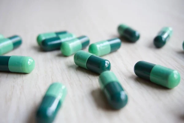 Several Green Pharmacy Capsules Backlit Selective Focus Medication Use — Stock Photo, Image
