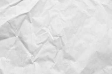 Buruşmuş kağıtlarla kaplanmış yaratıcı bir arka plan..