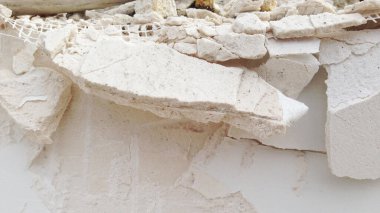 Cracked and obsolete gray wall.