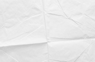 Buruşmuş kağıdın dağınık kaplamasına sahip yaratıcı bir arka plan.