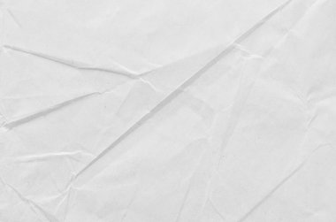 Buruşmuş kağıdın dağınık kaplamasına sahip yaratıcı bir arka plan.