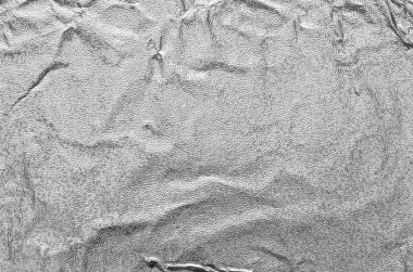 Buruşmuş kağıdın dağınık kaplamasına sahip yaratıcı bir arka plan.