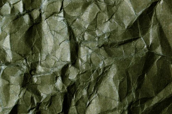 background with scattered overlay of crumpled papers.