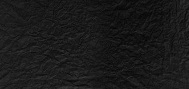 Arkaplanı buruşuk kağıtlarla kaplanmış..