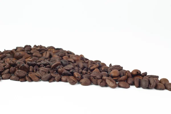 Roasted coffee beans on white background — Stock Photo, Image