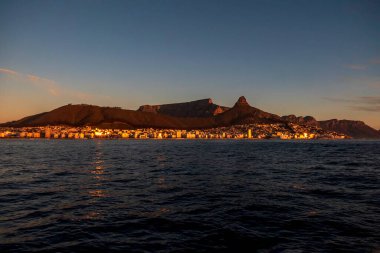 View of the table mountain in Cape Town at sunset from the sea. South Africa