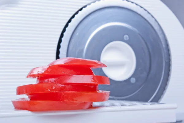 Tomato sliced with a slicer — Stock Photo, Image