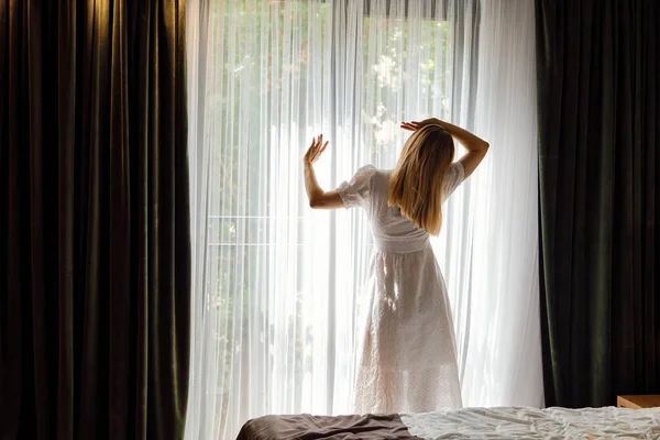 Girl White Dress Stretches Getting Out Bed Looking Out Window —  Fotos de Stock
