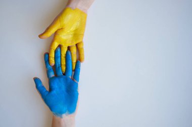 Children's hands are painted yellow-blue. Stop War. Children against war. Independence of Ukraine. Flag. Ukraine love concept. Children of Ukraine