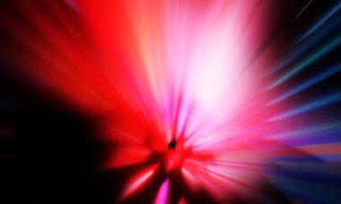 Siyah zemin üzerinde ışık parçacığı izleri. Parlayan parçacıkları ve çizgileri olan ışık patlaması yıldızı. Güzel hareketli soyut ışınlar duvar kağıdı. Renkli Patlama grafiği. Işık ışınlarının patlaması. 