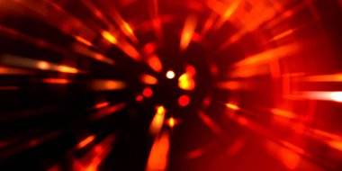 Parlayan ışıkları hareket ettirmenin havalı arka planı. Tasarımınız için canlı renkli bir portal şablonu. Işık ışınları ve hareket halindeki ışıldayan parçacıklar bir solucan deliği şekli oluşturuyor..