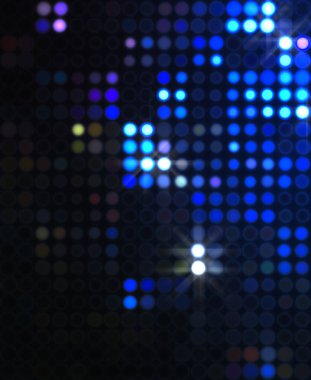 Parlak desenli duvar kağıdı. Sahne ışıkları olan renkli ışıkların ihtişamlı arkaplanı. Parlayan ışıklar siyah arka planda parti izleri. Sahne veya stadyum ışıklarının dijital illüstrasyonu. 