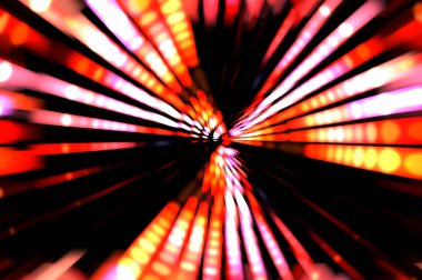 Siyah arkaplanda dönen ışık gösterisi. Lüks çizgiler. Parlak kıvrımlı duvar kağıdı. Uzay tüneli. Dönen ışık çemberi ya da maytap izi. Parlak konsept çizimi.