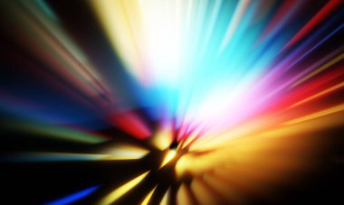 Siyah zemin üzerinde ışık parçacığı izleri. Parlayan parçacıkları ve çizgileri olan ışık patlaması yıldızı. Güzel hareketli soyut ışınlar duvar kağıdı. Renkli Patlama grafiği. Işık ışınlarının patlaması. 