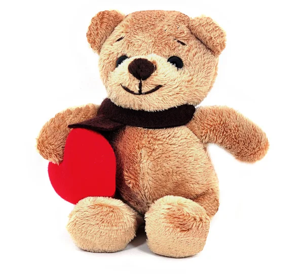 Teddybär hält ein Herz. Stockfoto