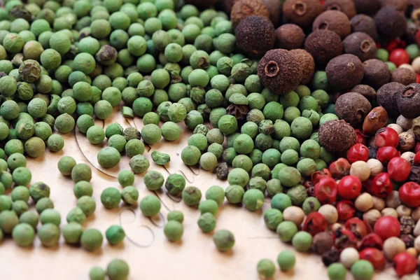 Assorted peppercorns background — Stock Photo, Image