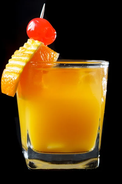 Exotic orange cocktail on black — Stock Photo, Image