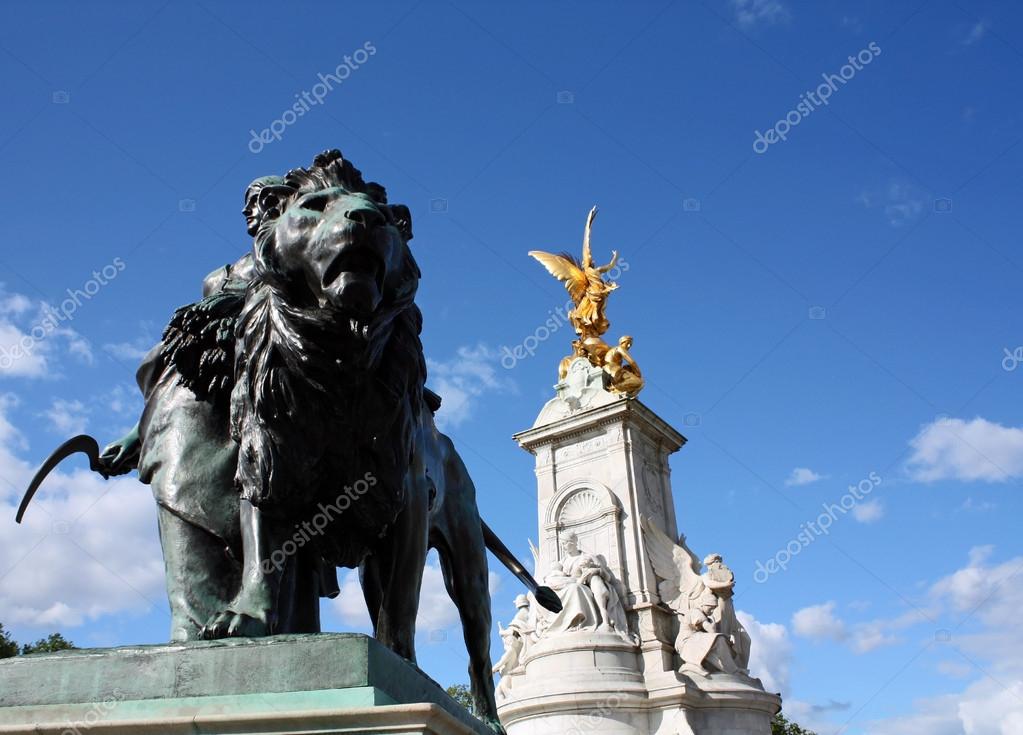 Lion Statue in front of Buckingham Palace. Stock Editorial Photo