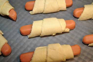 Raw Pigs in a Blanket Ready for the Oven clipart