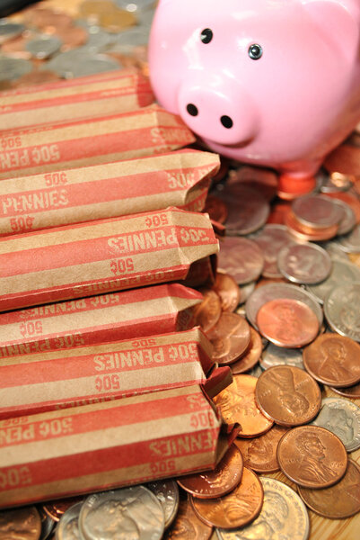 Rolled Pennies with a Piggy Bank and Coins