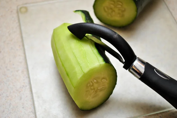 Peeling a Fresh Summer Cucumber — Stock Photo, Image