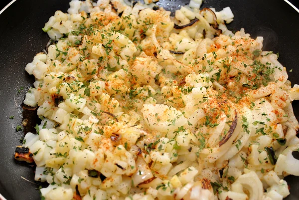 Raw Potatoes and Onions Frying in a Pan — Stock Photo, Image