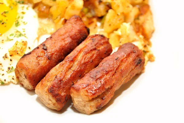 Nahaufnahme von drei Wurstlinks zum Frühstück — Stockfoto