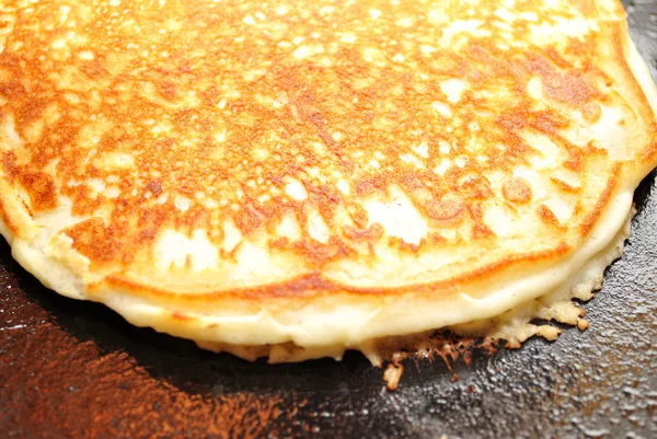 Browned Pancake Cooking in a Pan — Stock Photo, Image