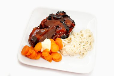 Delicious Summer Meal of Pork Rib, Carrots and Pasta clipart