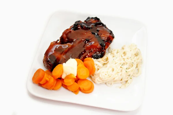 Delicious Summer Meal of Pork Rib, Carrots and Pasta — Stock Photo, Image