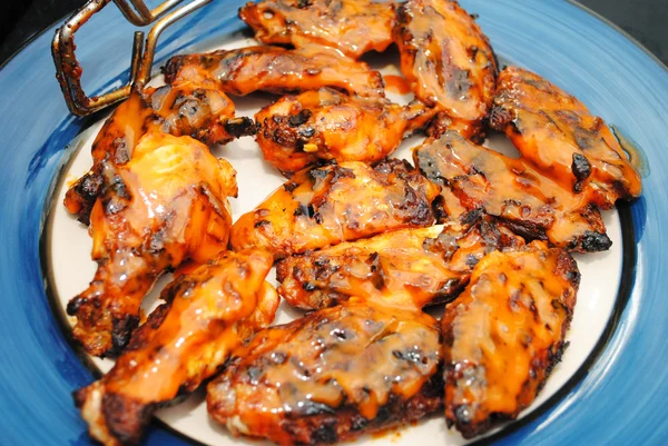 Spicy Chicken Wings on a Blue and White Plate — Stock Photo, Image