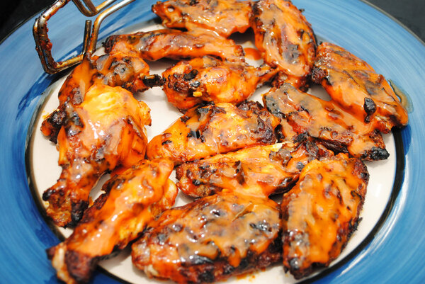 Spicy Chicken Wings on a Blue and White Plate