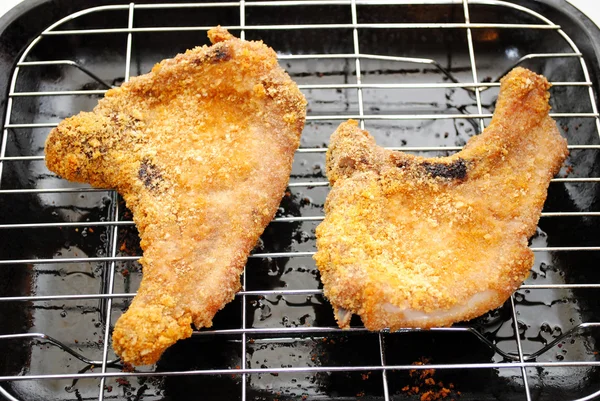 Two Crispy Cooked Pork Chops Hot From the Oven — Stock Photo, Image