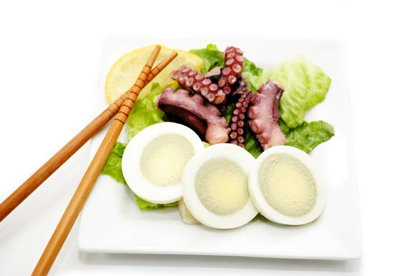 Eating Egg and Octopus Salad with Chopsticks — Stock Photo, Image